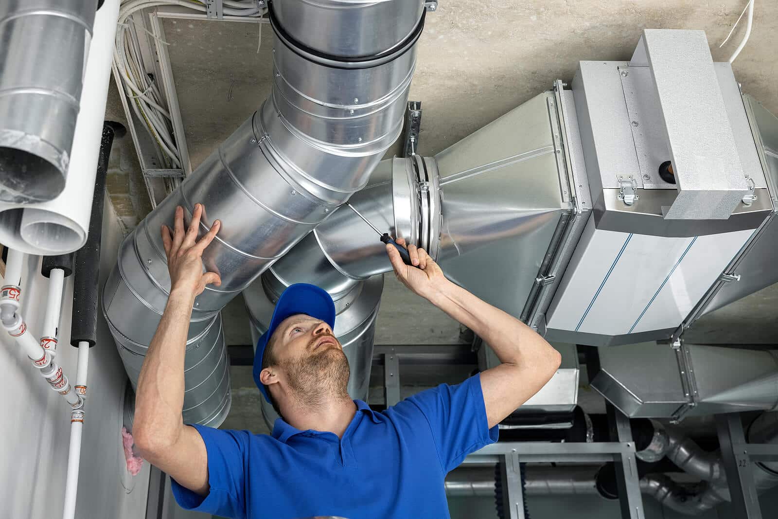 HVAC technician inspecting and repairing air ducts in San Francisco