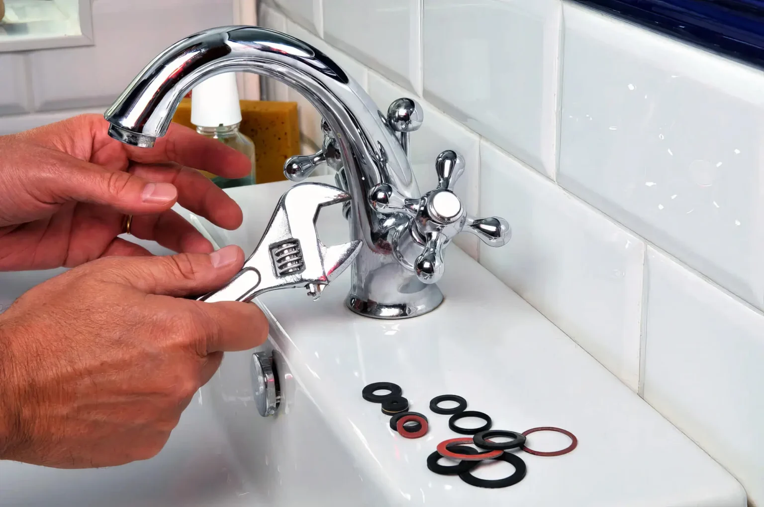 Plumber maintaining a bathroom faucet in San Francisco