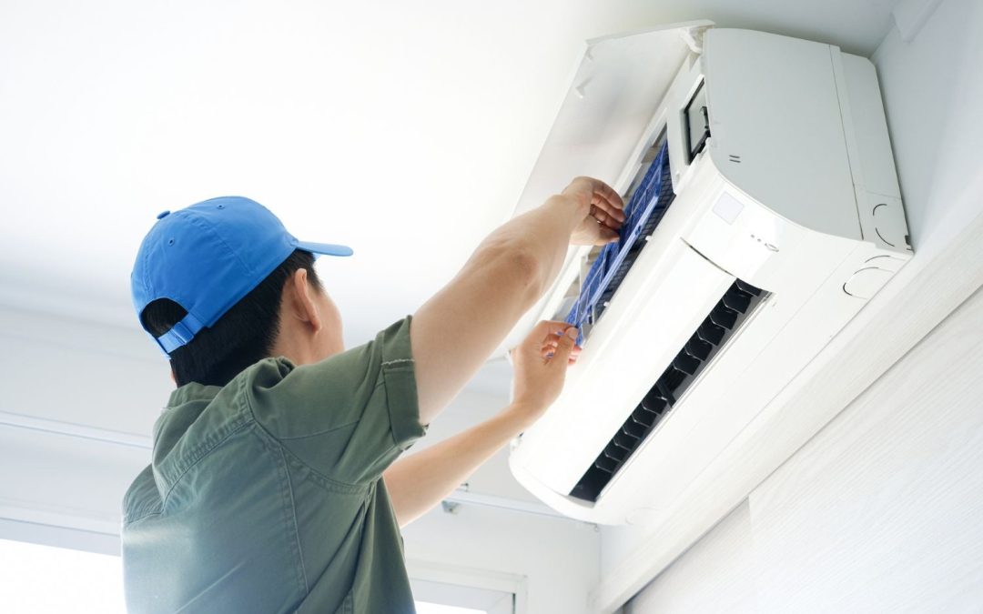 HVAC technician servicing a ductless mini split in San Francisco