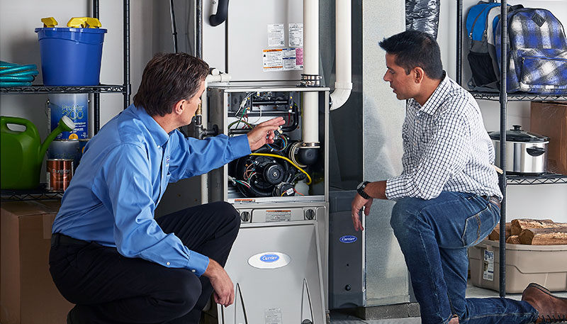 Technician evaluating a furnace for repair or replacement in San Francisco