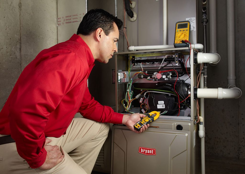 Heating technician diagnosing a furnace repair in San Francisco