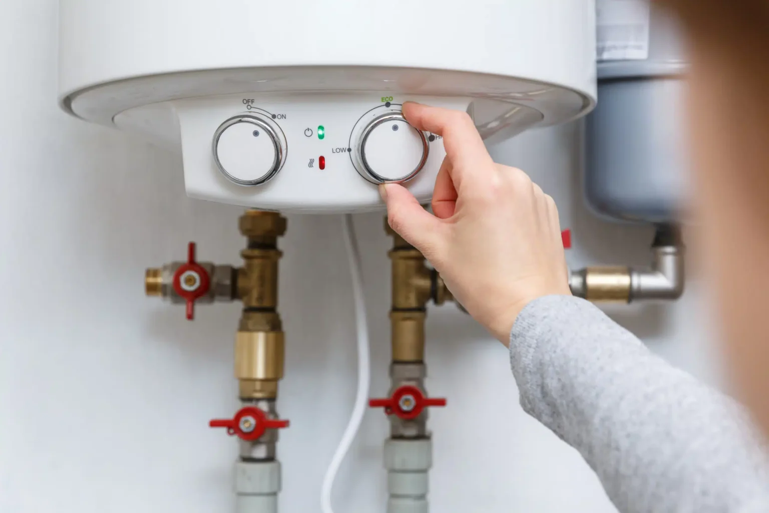 Technician adjusting a water heater in San Francisco